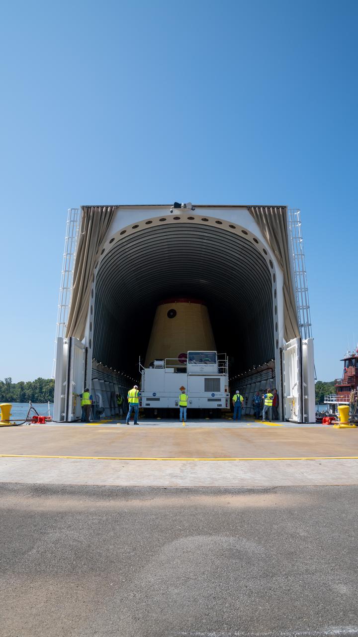 NASA rolled out a key piece of space flight hardware for the SLS (Space Launch System) rocket for the first crewed mission of NASA’s Artemis campaign from Marshall Space Flight Center in Huntsville, Alabama, on Wednesday, Aug. 21 for shipment to the agency’s spaceport in Florida. The cone-shaped launch vehicle stage adapter connects the rocket’s core stage to the upper stage and helps protect the upper stage’s engine that will help propel the Artemis II test flight around the Moon, slated for 2025. Manufactured by prime contractor Teledyne Brown Engineering and the Jacobs Space Exploration Group’s ESSCA (Engineering Services and Science Capability Augmentation) contract using NASA Marshall’s self-reacting friction-stir robotic and vertical weld tools. Crews moved the adapter out of NASA Marshall’s Building 4708 to the agency’s Pegasus barge Aug. 21. The barge will ferry the adapter first to NASA’s Michoud Assembly Facility in New Orleans, where crews will pick up additional SLS hardware for future Artemis missions, before traveling to NASA Kennedy. Once in Florida, the adapter will join the recently delivered core stage. There, teams with NASA’s Exploration Ground Systems will prepare the adapter for stacking and launch.